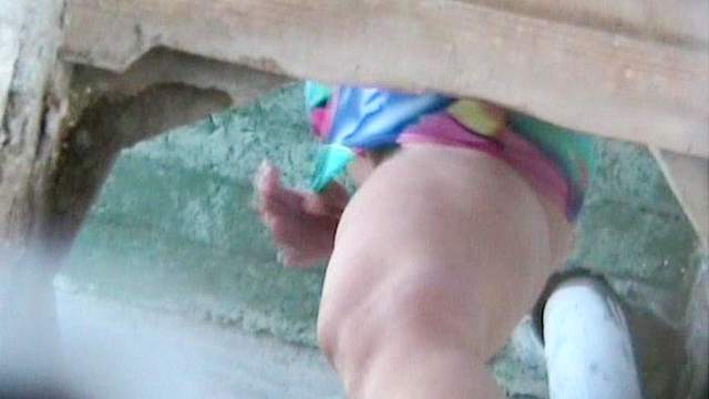 Slender babe with shaved is pissing in voyeur video