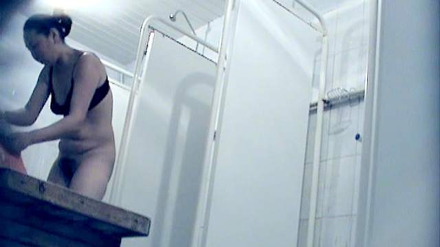 Stunning brunette is getting her pussy wet under the shower