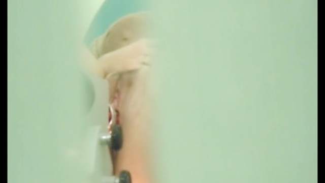 Spicy brunette in the medical chair with voyeur cam