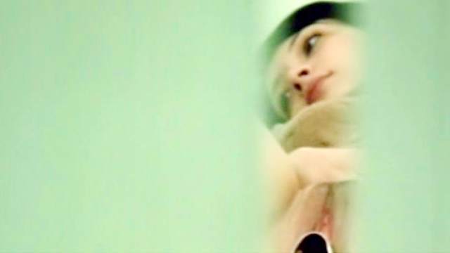 Spicy brunette in the medical chair with voyeur cam