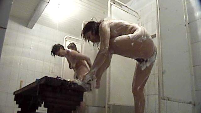 Naked babes are getting wet in the soapy shower