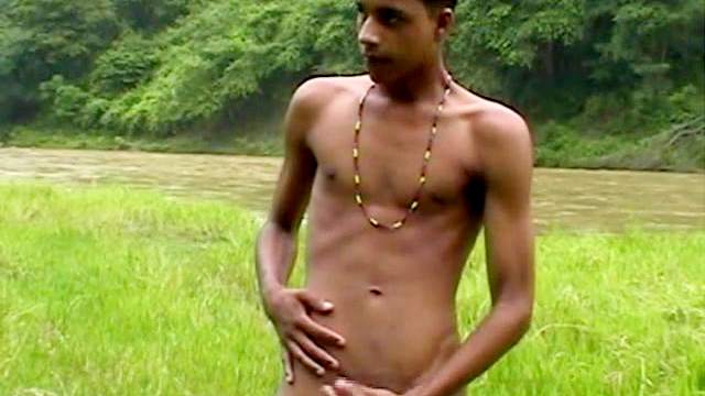 Black gay is masturbating outdoors in a solo video
