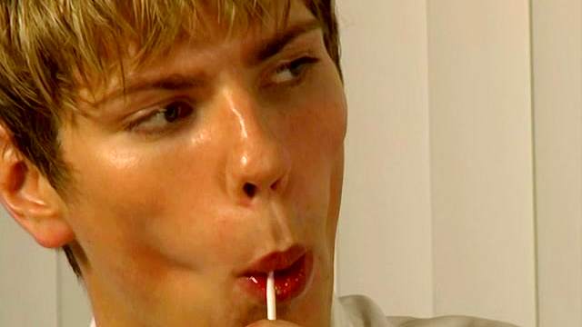 Sexy blonde gay gives a blowjob in the bedroom