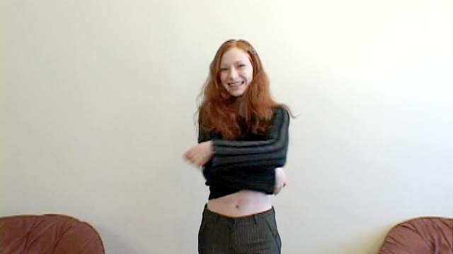 Slim redhead babe Millena demonstrates her puss