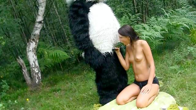 Dark-haired babe fuck in the forest with panda