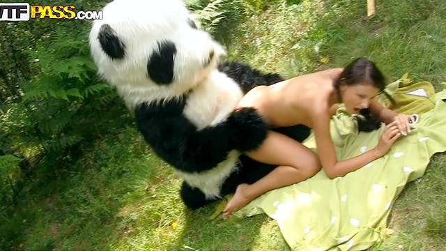 Dark-haired babe fuck in the forest with panda