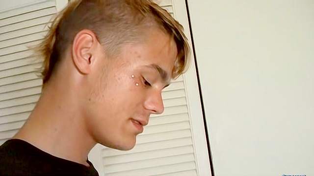 Sexy gay is sitting and masturbating his hard dick