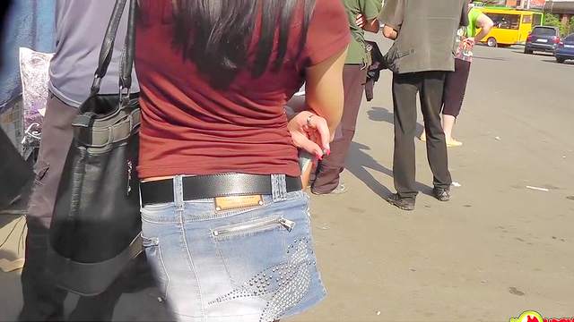 Brunette girls in Jeans are filmed upskirt in the street
