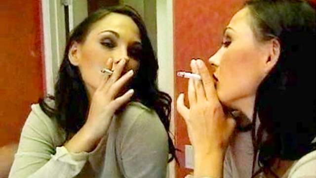 Brunette has cigarette in front of a mirror