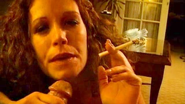 Curly-haired model is smoking and sucking a dick