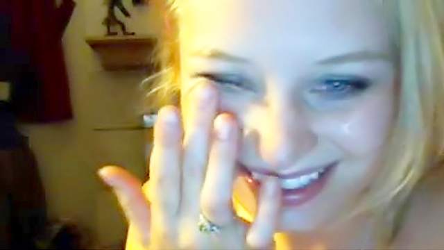 Smiling blonde is sucking a dick on the cam