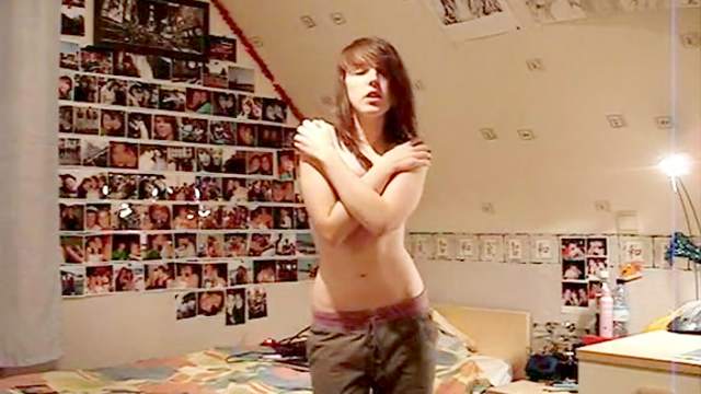 Brunette emo dances in topless video