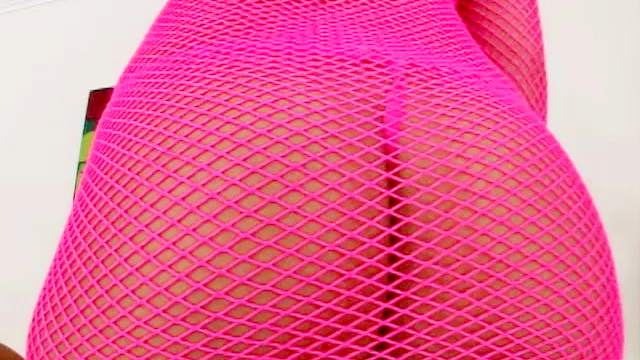 Oiled blonde in pink fishnets has anal sex