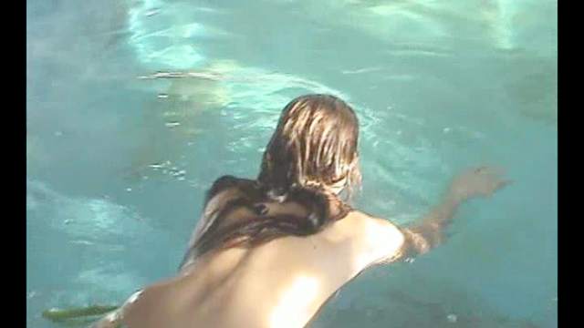 Dark-haired chick is swimming naked
