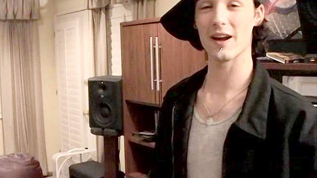 Dude wearing a cap spanks his teen partner's ass