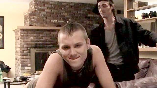 Dude wearing a cap spanks his teen partner's ass