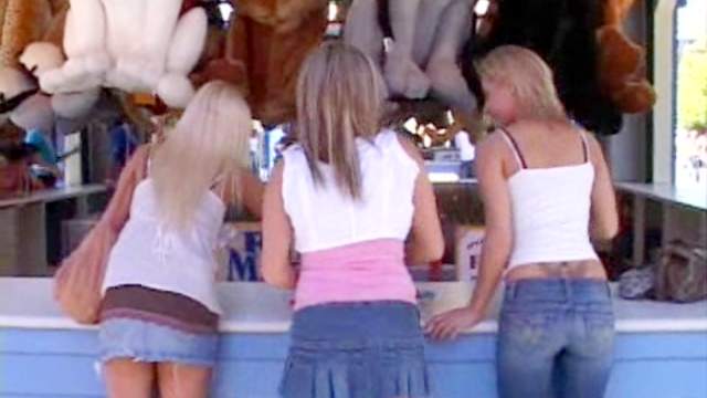 Two girls play with their friend's big tits