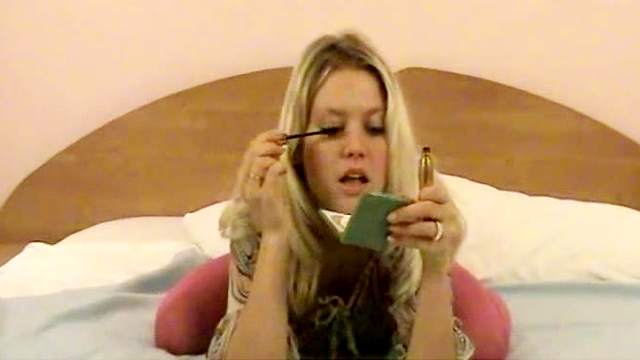 Amateur blonde teen applies makeup and shows beautiful tits