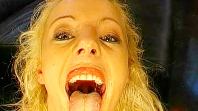 Curly-haired blonde swallows giant loads of juice