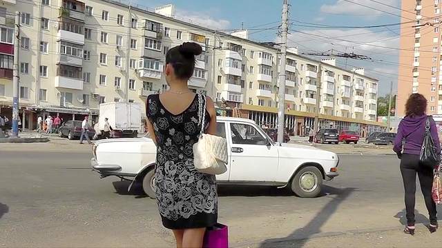 Outdoor scene with a young girl in sexy dress