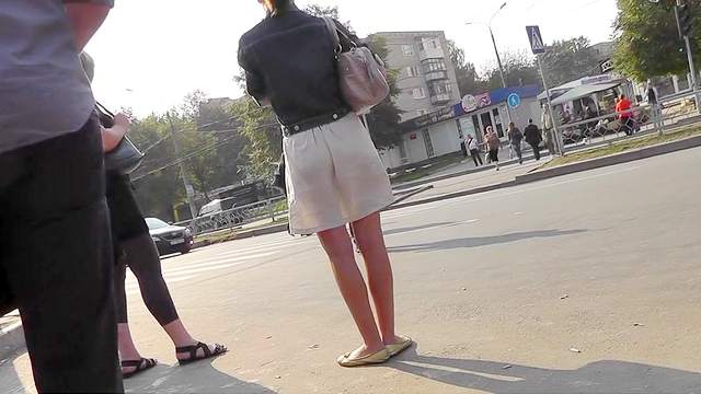 Sexy upskirt on the street with leggy brunette