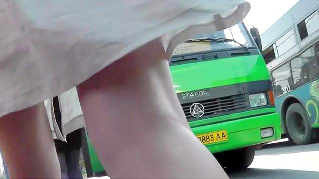 Sexy upskirt on the street with leggy brunette