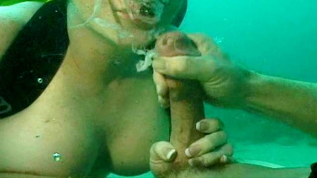 Busty girl having underwater sex with her man