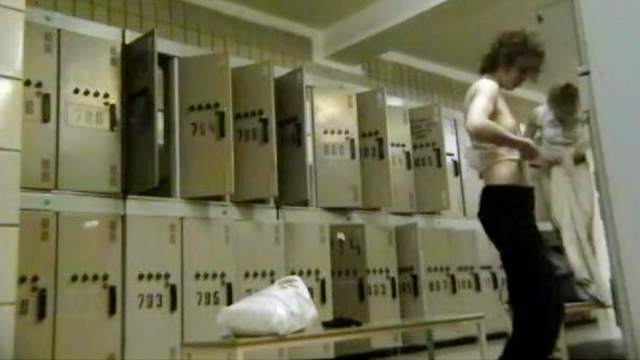 Alluring babe is getting naked in the locker room