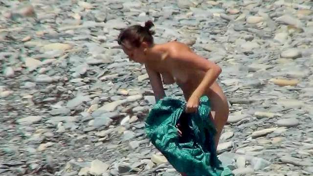 Sexy nudists are walking in the sea