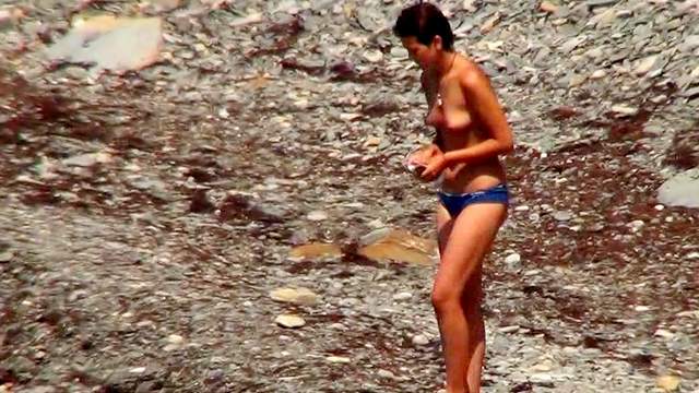 Skinny brunette is posing completely naked