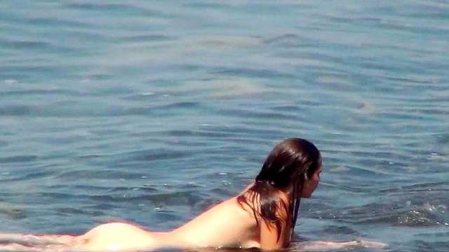 Skinny brunette is posing completely naked