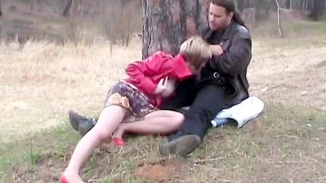 Sweet brunette is giving an outdoor blowjob