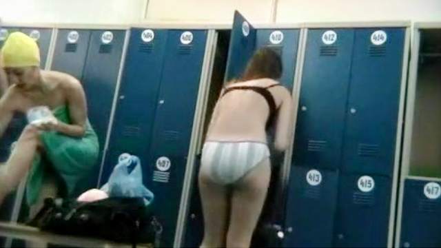 Assy chick is getting naked in the locker room