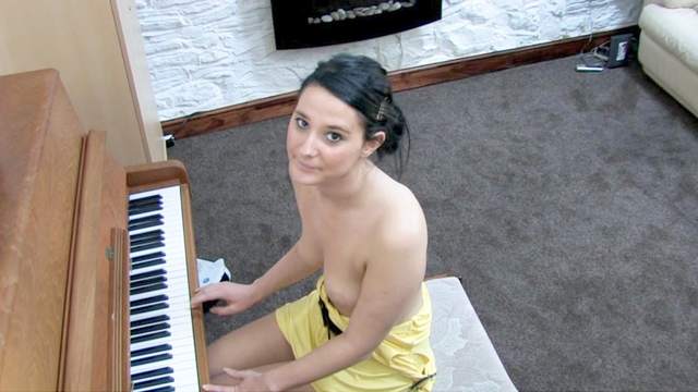 Awesome babe Elise is playing on piano