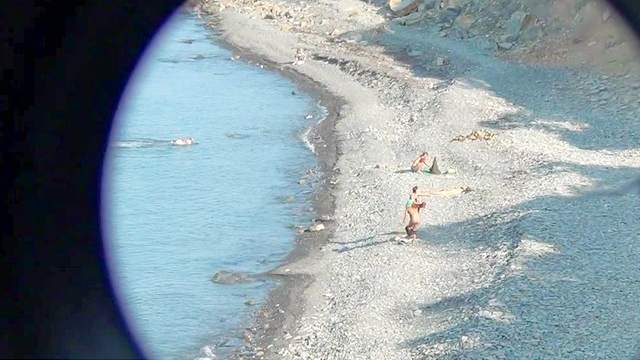 Sexy babes nudists are tanning on the beach