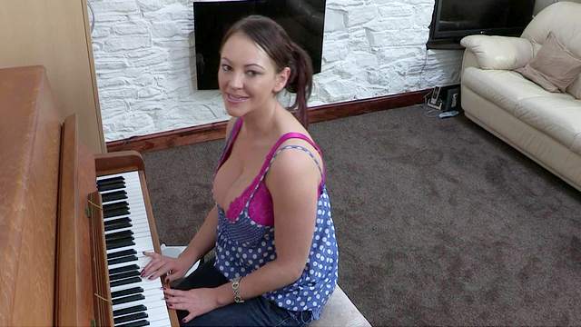 Busty brunette Vickie is playing on piano