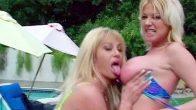 Two busty mommies are banging at the poolside