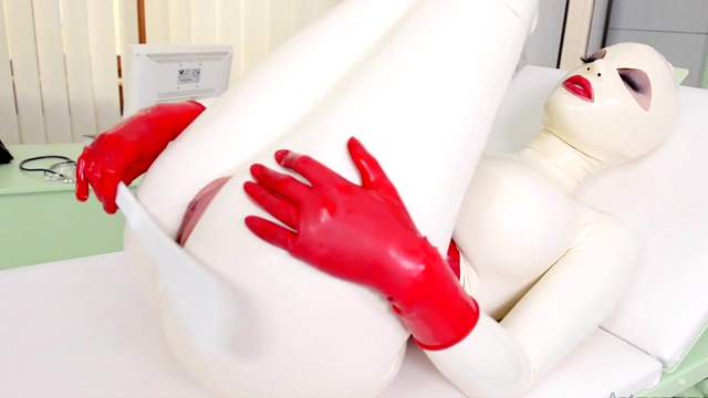 Full latex fantasy and kinky solo display with a busty woman