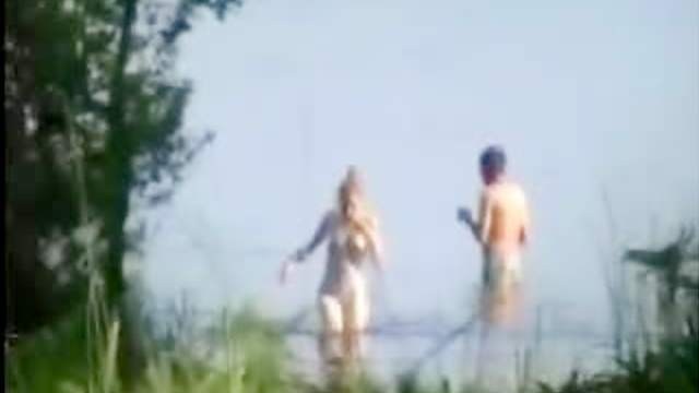 Voyeur porn of couple fucking in lake