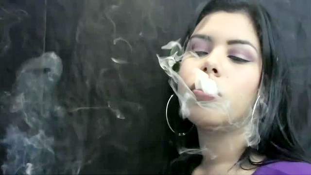 Thick lips girl smokes a cigarette