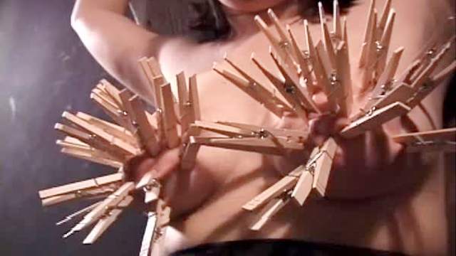 Nipple torture with clothes pins
