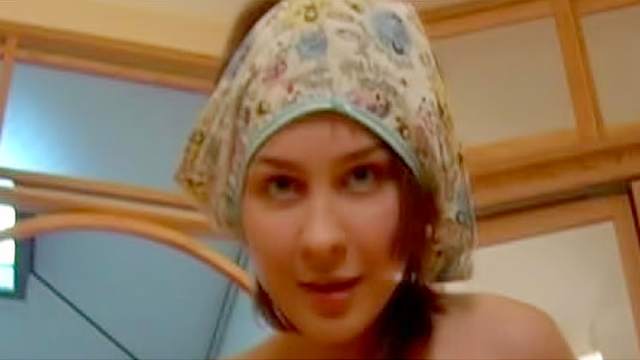 Teen in warm fuzzy cap plays with vagina