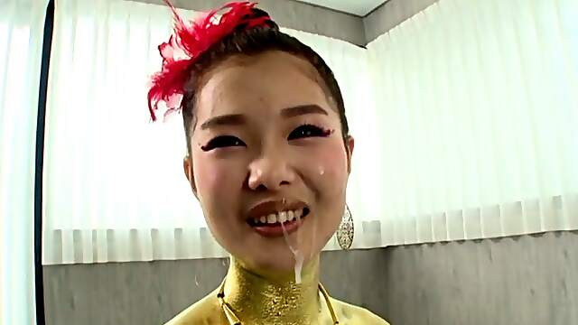 Asian blows hard before taking sperm on her golden costume