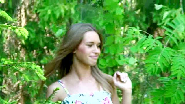 Slutty and curious brunette with long hair is pissing in the forest