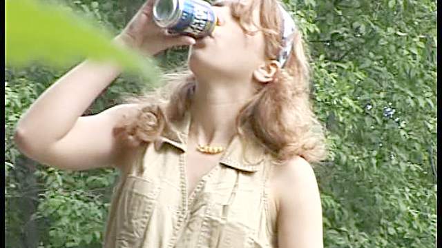 Chick drinks a beer and pisses outdoors