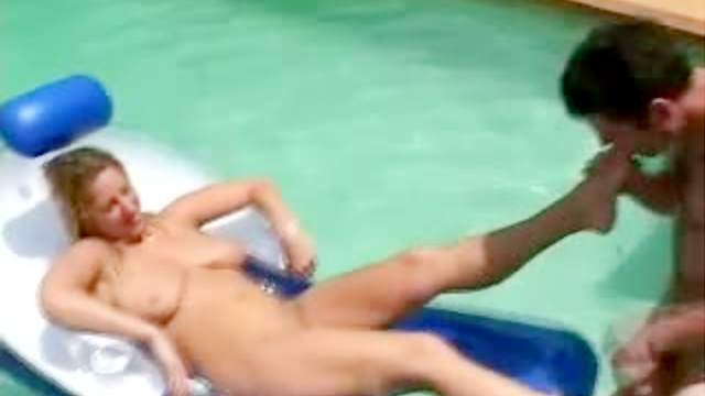 Footjob in the pool for slick cock