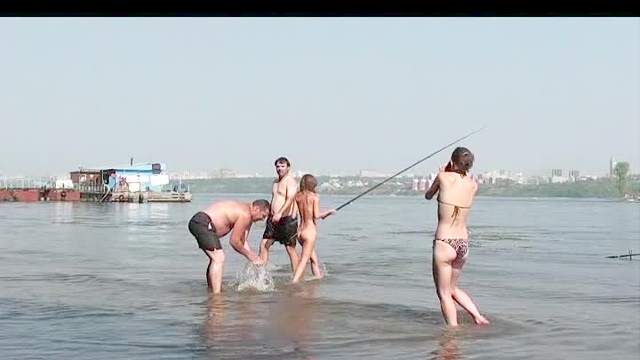 Nude girl prancing in the river