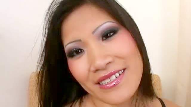 Asian slides glass toy into her slit