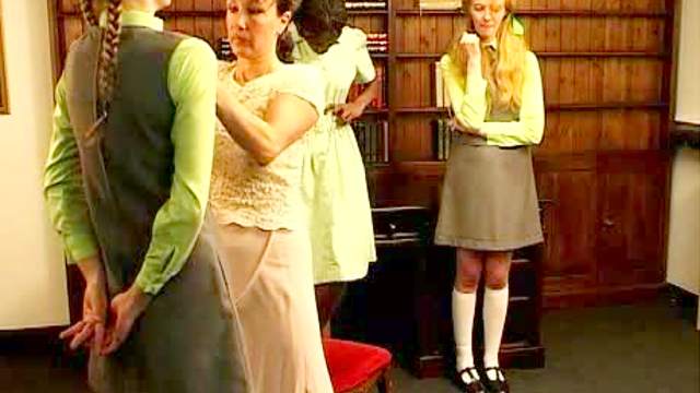 Demure schoolgirls spanked by mistress