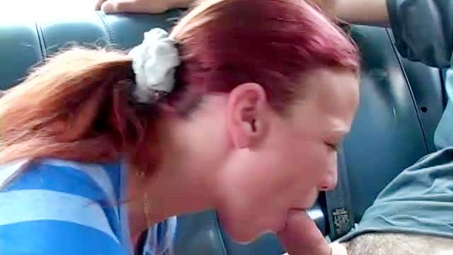 Redhead and busty Brandi Mae is doing blowjob in the car